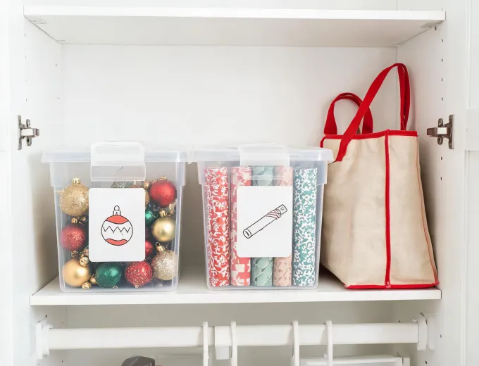 Holiday storage shelf organized with labeled boxes